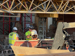03 Brick is removed and hauled away in a bucket.jpg
